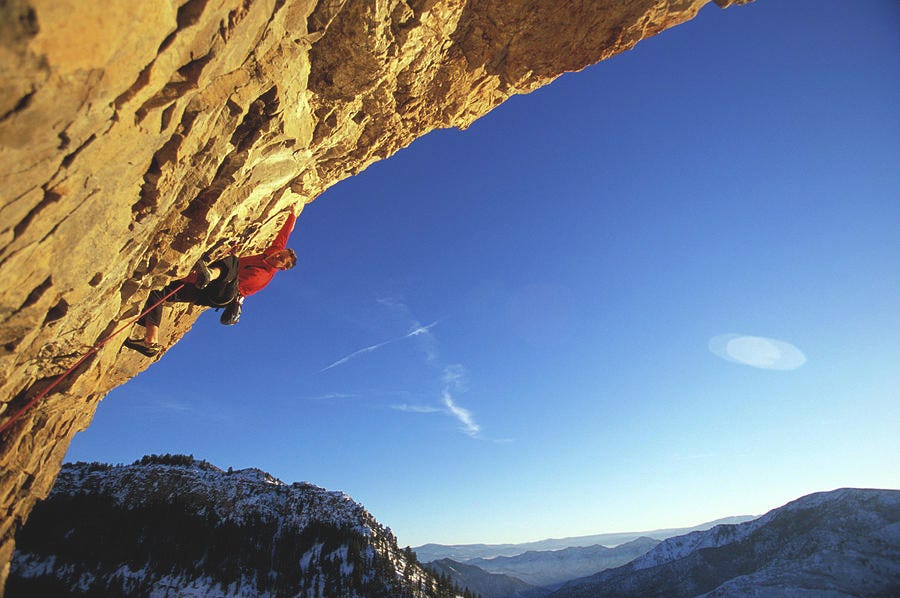 A Man Rock Climbing A Difficult Photograph by Corey Rich