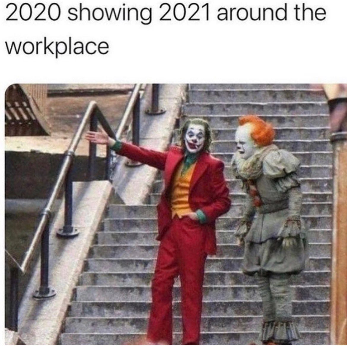 Joaquin Phoenix as The Joker points something out to Pennywise the Clown. Caption: 2020 showing 2021 around the workplace.