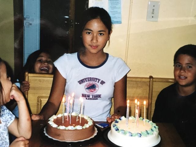 sixth grade me with two bday cakes