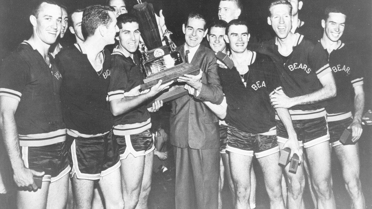 Pete Newell and his players pose with the 1959 National Championship Trophy after beating Oscar Robinson and then Jerry West.