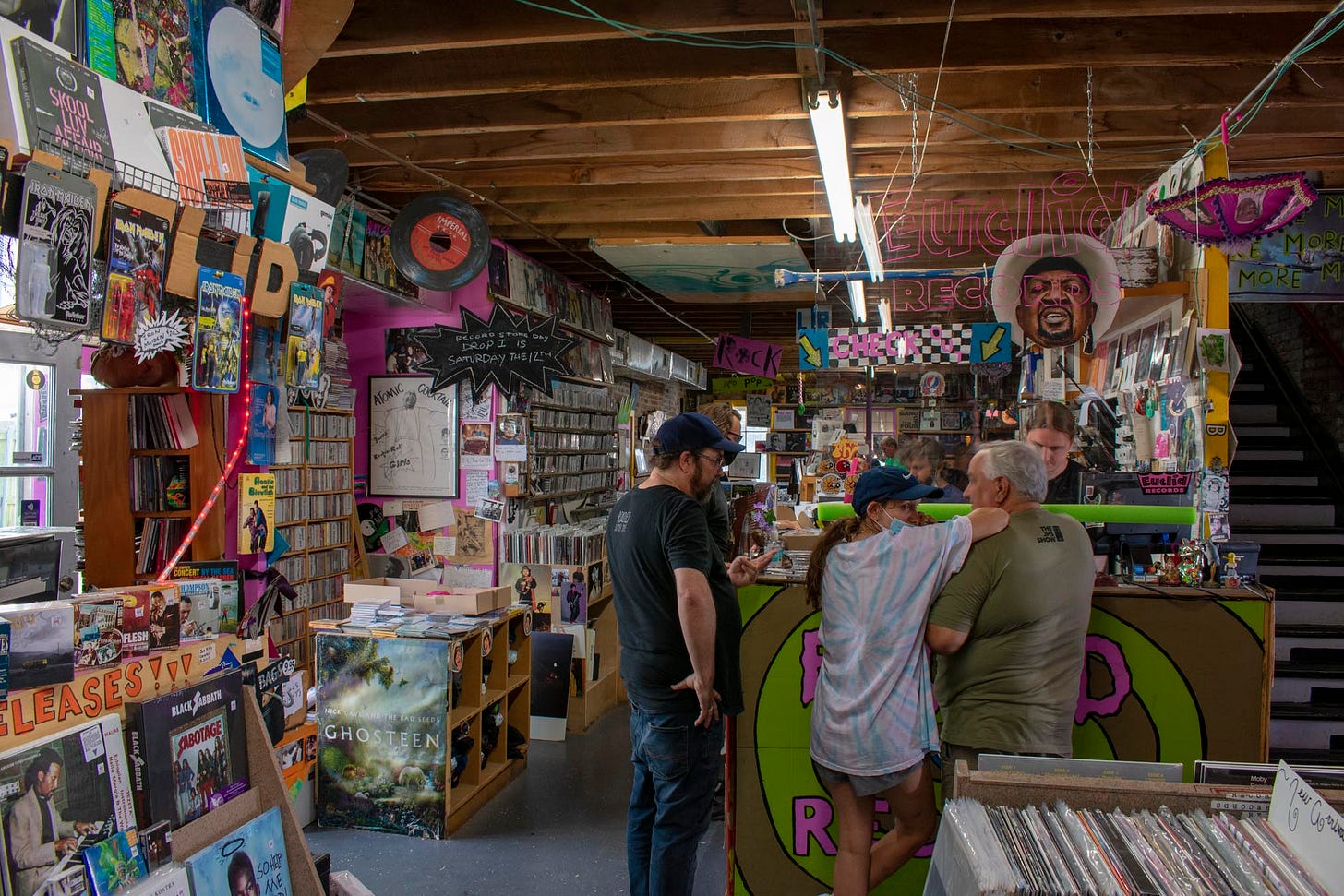 DJ C’est Funk (left) and NOLA Mix owner, Ben Epstein (right) prepare turntables for Record Store Day 2021.