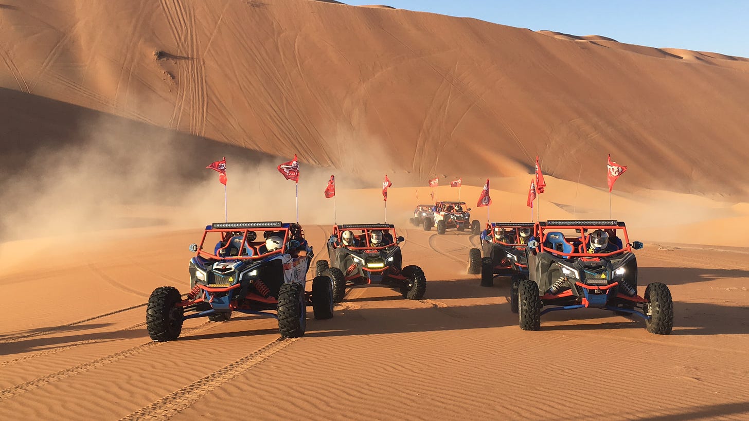 Dune buggies racing across the sand