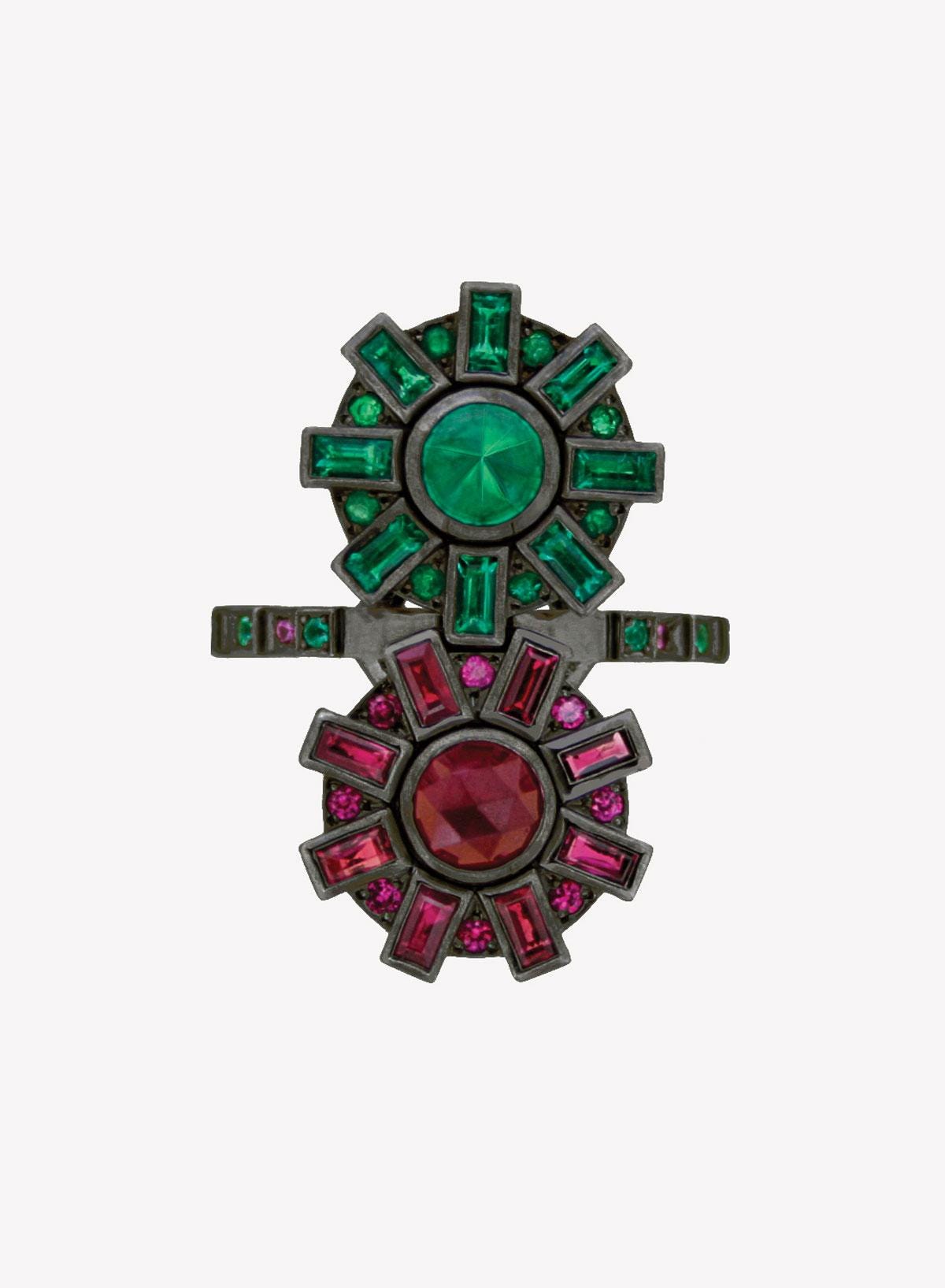 ruby and emerald cogs ring against a white background