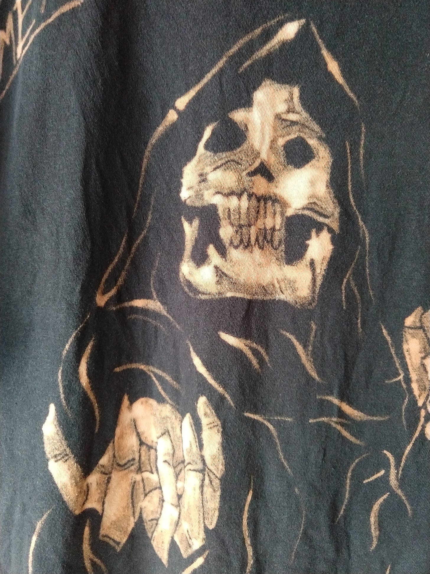 t-shirt detail: Death's hand reaching out, beckoning
