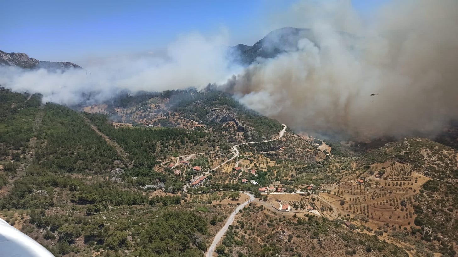 Smoke rises from a wildfire in Datca