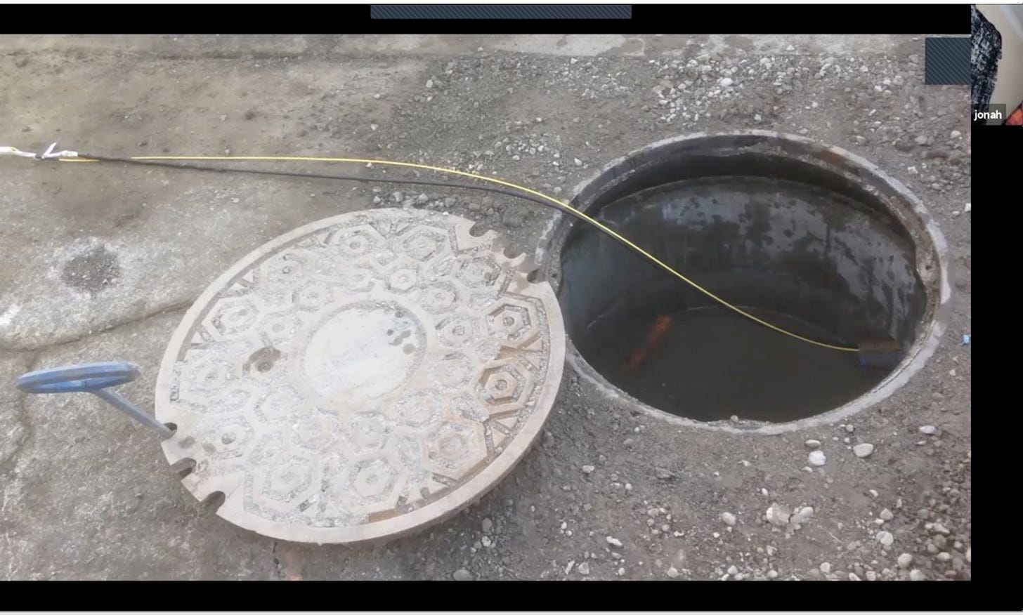 fiber cable going through manhole