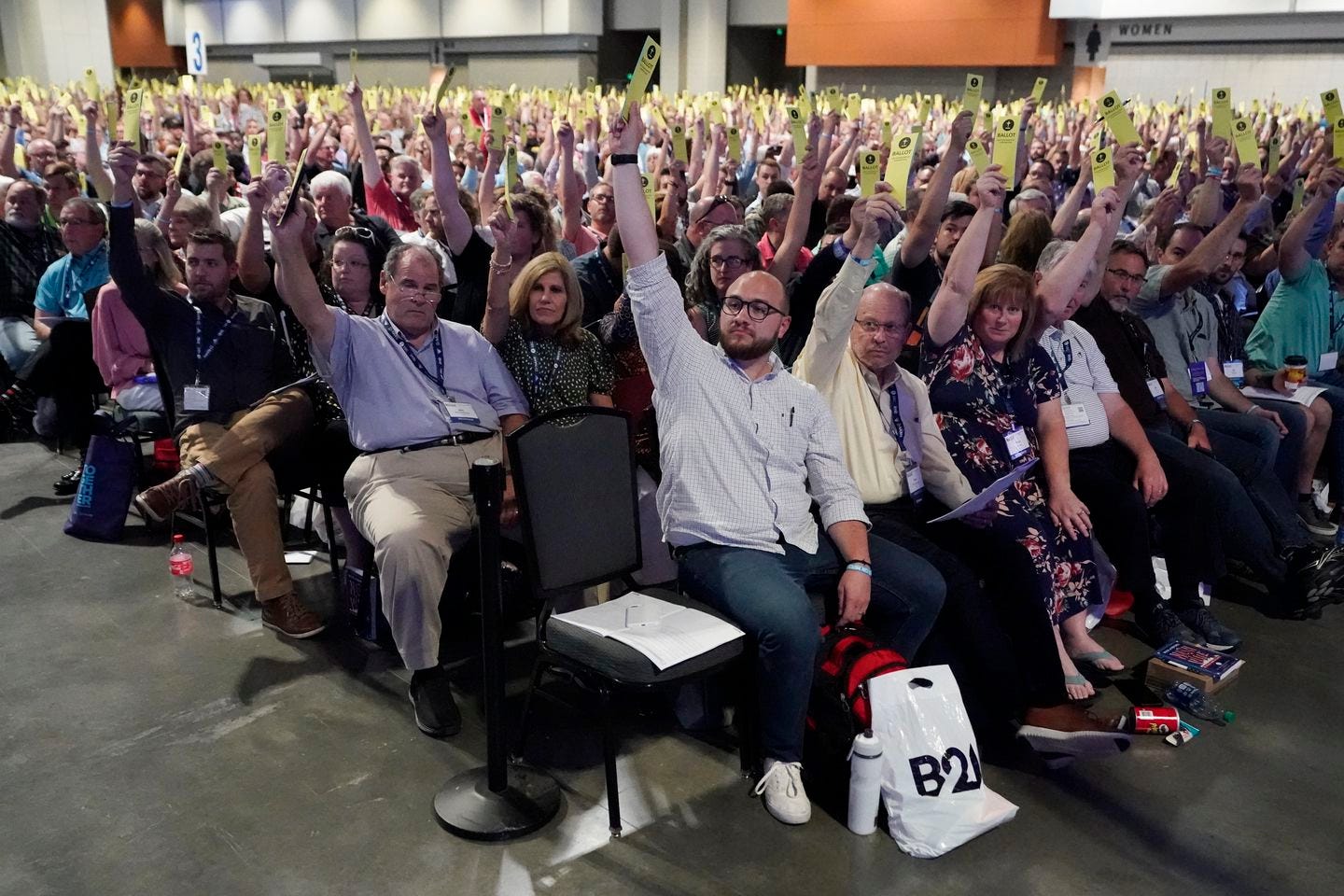 People voted on a motion during the annual Southern Baptist Convention meeting Tuesday in Nashville.