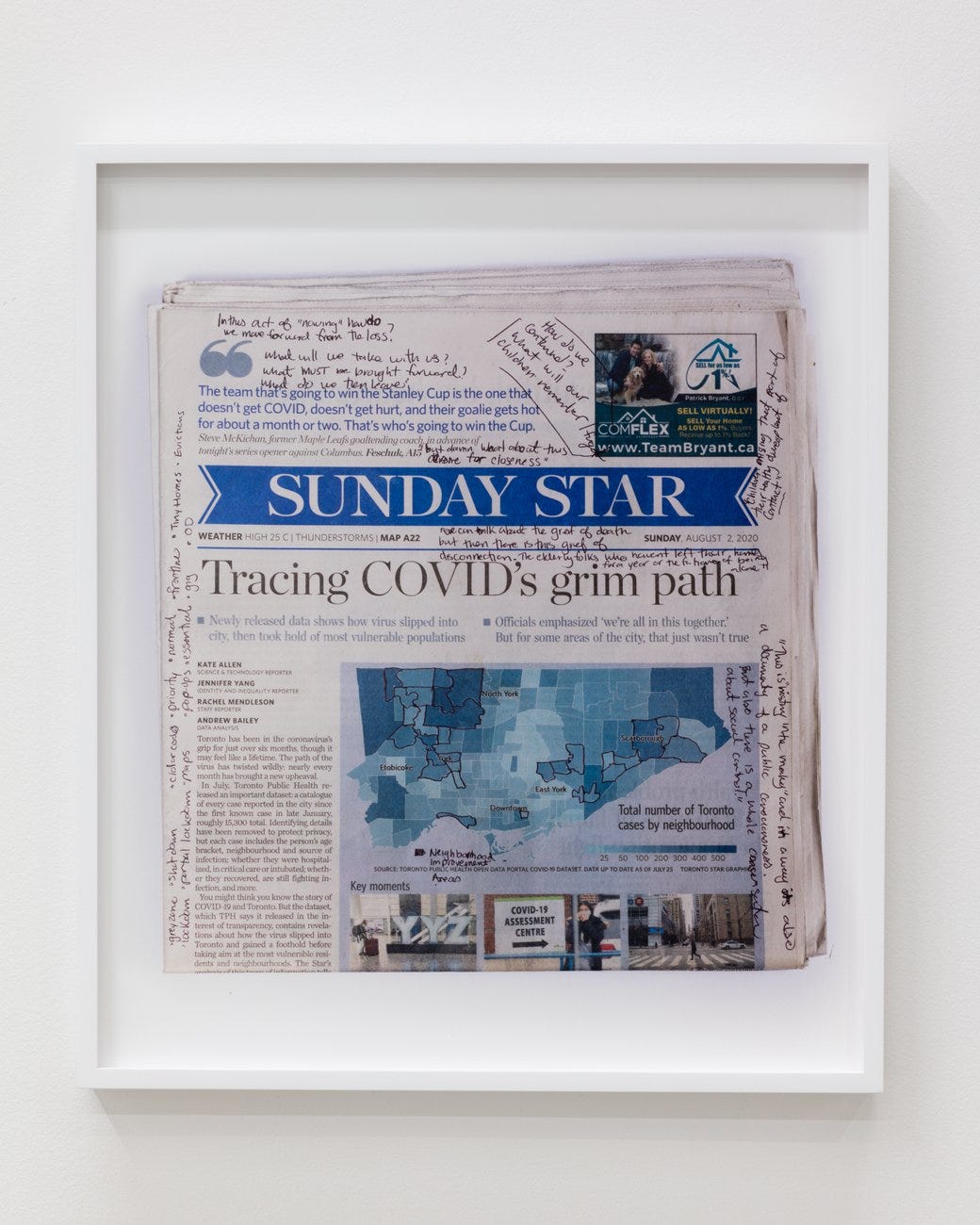 A framed copy of the Sunday Star newspaper with handwritten marginalia on a story called "Tracing COVID's grim path.'