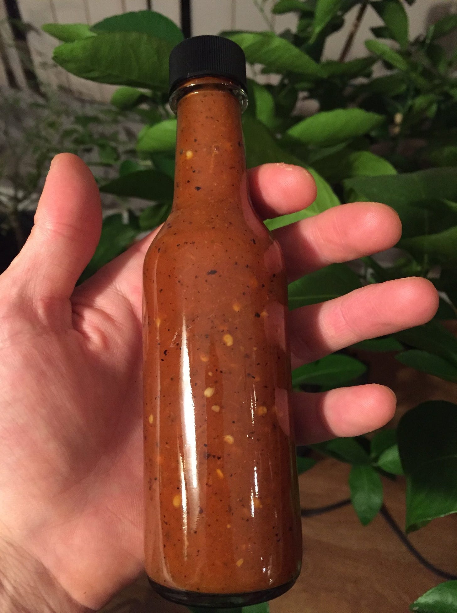 a bottle of finished fire roasted hot sauce 