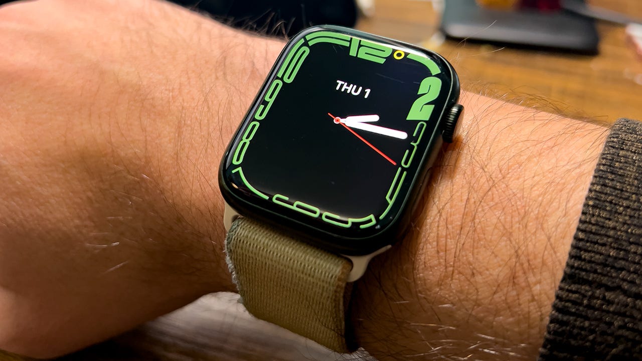 An Apple Watch Series 7 on a hairy wrist