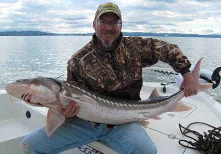 Hank Shaw with a sturgeon in 2012. 