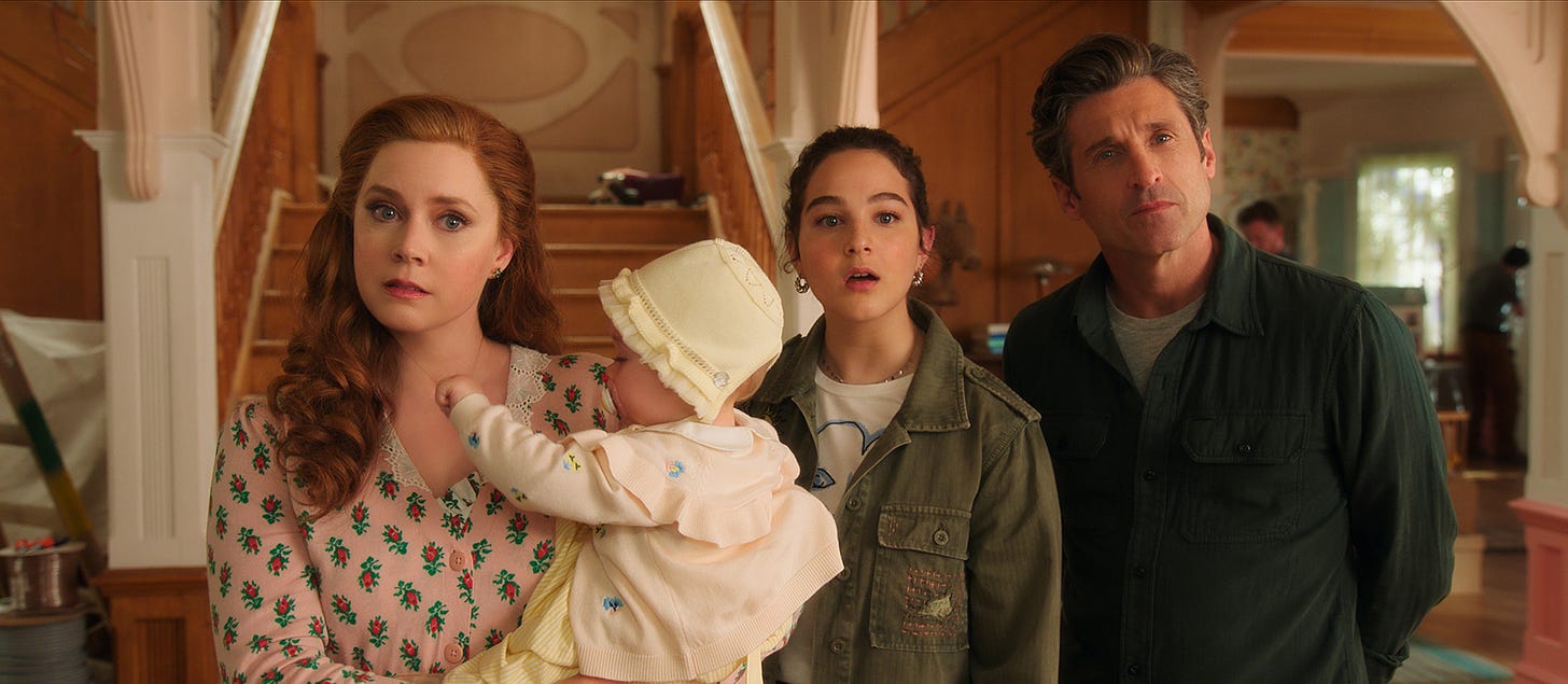 A still from DISENCHANTED with Amy Adams, Gabriella Baldacchino, and Patrick Dempsey looking on with confusion.