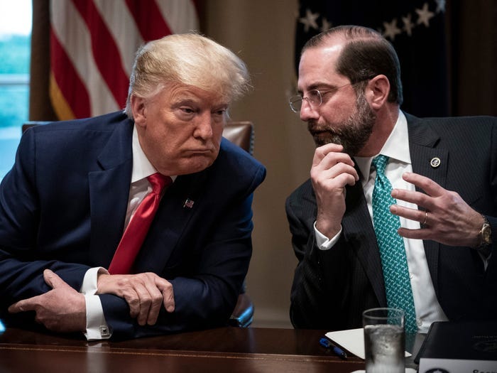Former US President Donald Trump speaks with former Secretary of Health and Human Services Alex Azar during a meeting with the White House Coronavirus Task Force in Cabinet Room of the White House on March 2, 2020.