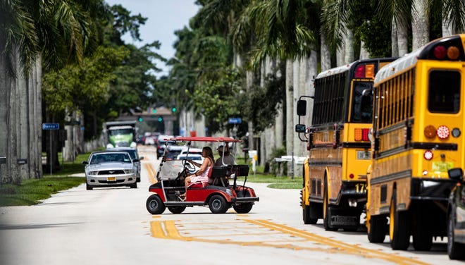 People use a golf cart for transportation along McGregor Boulevard just south of Colonial Boulevard in Fort Myers on Friday, Sept. 9, 2022.  