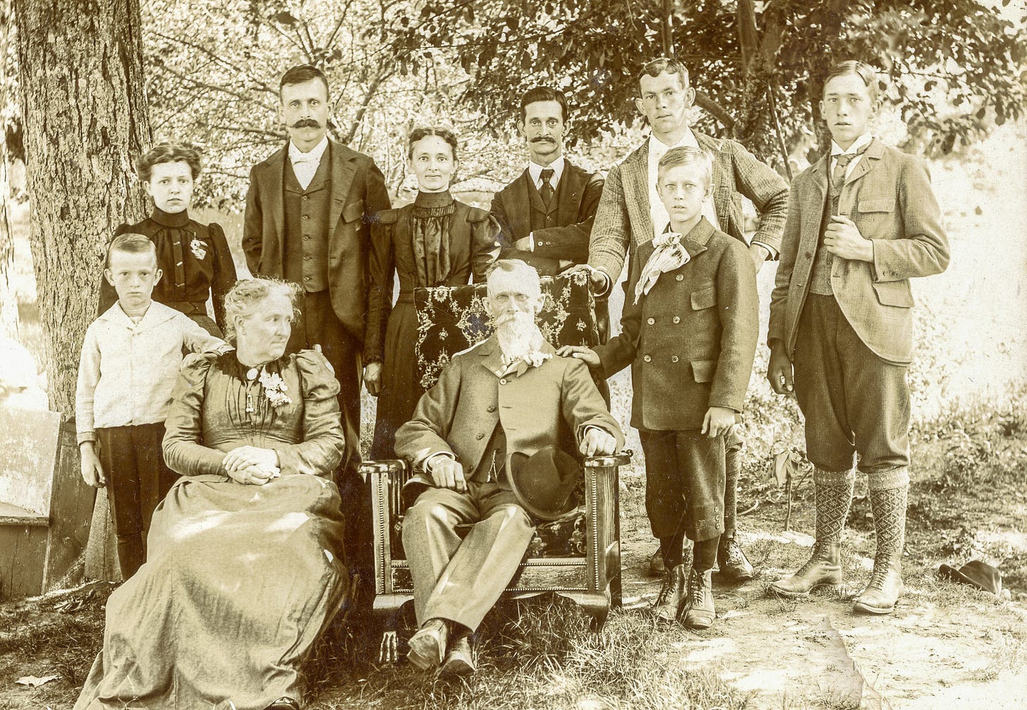 George Hardy seated, surrounded by family members