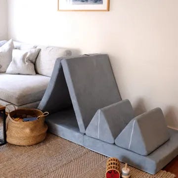 A stock image of a grey Possum Play Couch set up in a lounge room with beautiful decor