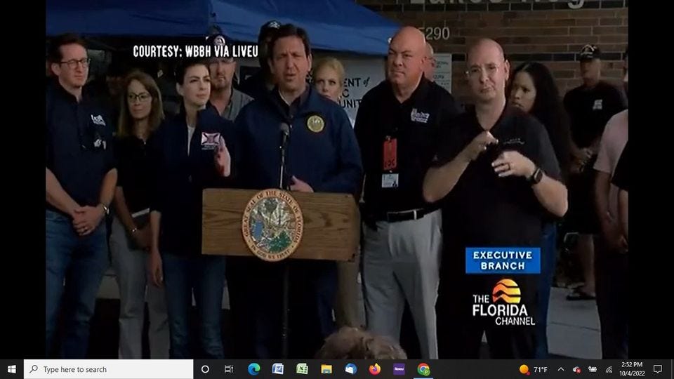 May be an image of 7 people, people standing and text that says 'COURTESY: WBBH VÌA LIVEU EXECUTIVE BRANCH Type here to search THE FLORIDA CHANNEL 71°F 2:52PM 10/4/2022'