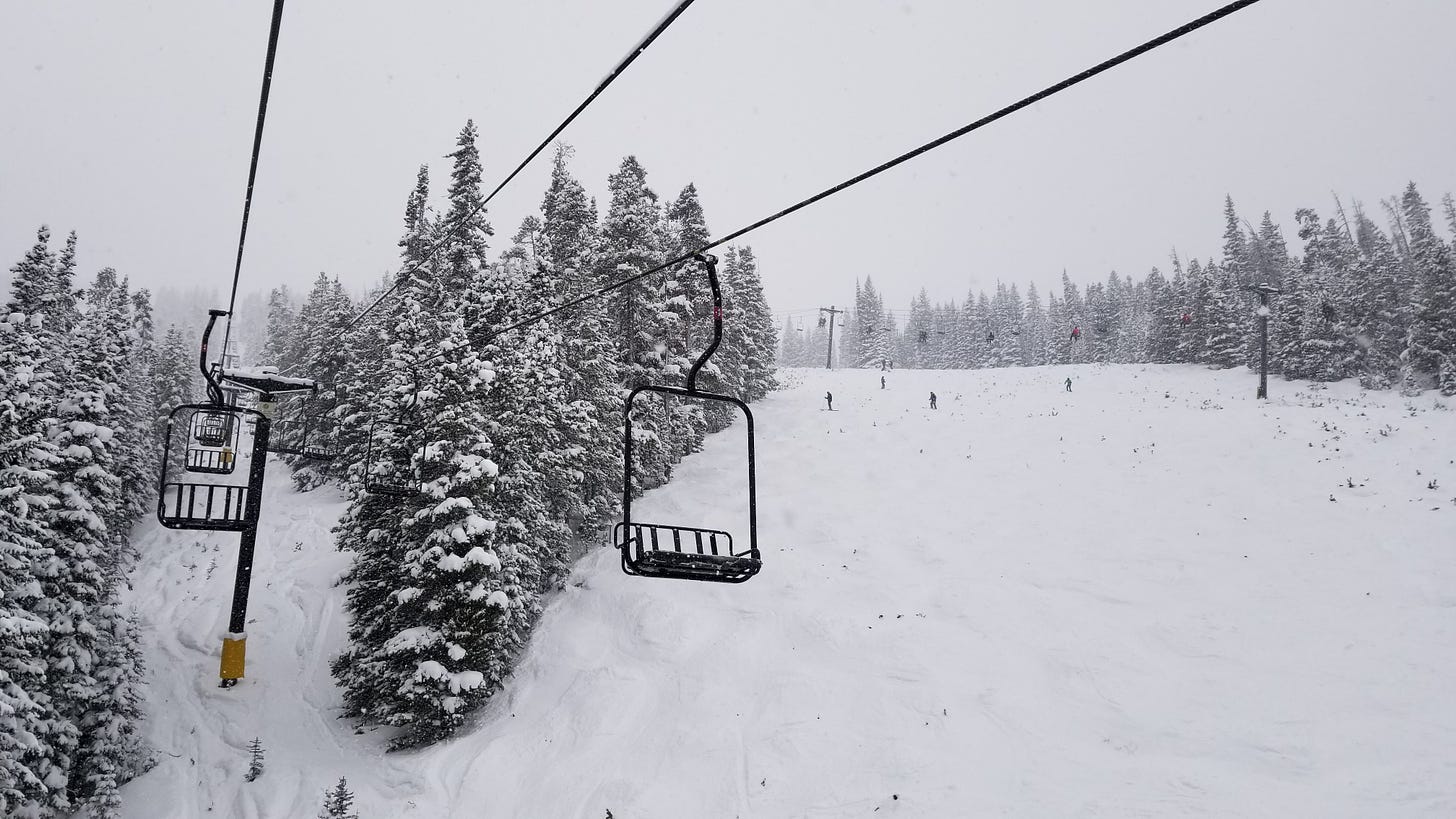 riding the ski lift on a snowy day