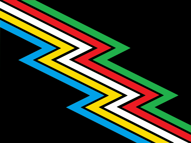 La bandiera del Disability Pride: sfondo grigio antracite/quasi nero attraversato diagonalmente dall'alto a sinistra al basso a destra da una banda "fulminea" divisa in strisce parallele di cinque colori: azzurro, giallo, bianco, rosso e verde. Ci sono bande strette dello stesso nero tra i colori.