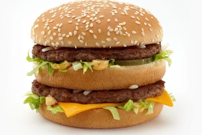 A large close up photo of a Big Mac sandwich