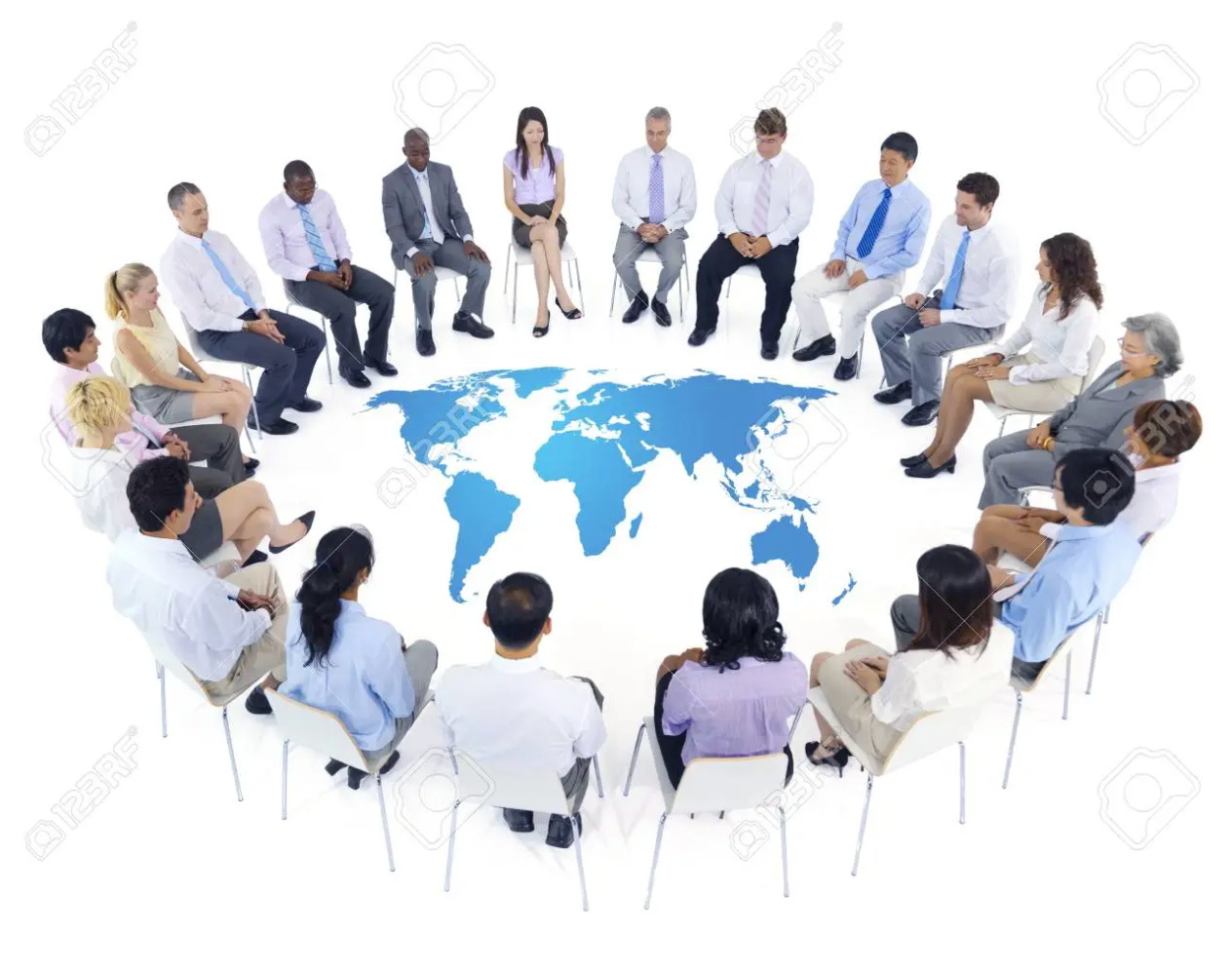 Stock photo of a diverse group of people sitting in a circle around a map of the world. Watermark visible: 123RF