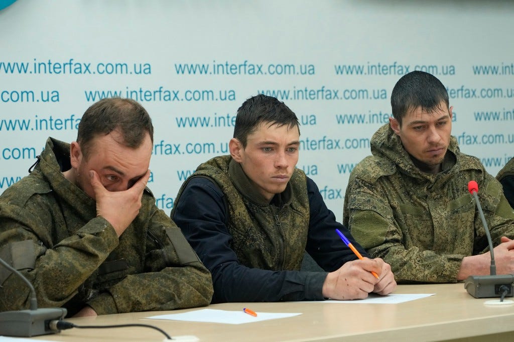 Captured Russian soldiers answer media questions at a press conference in the Interfax news agency in Kyiv, Ukraine, Saturday, March 5, 2022. 