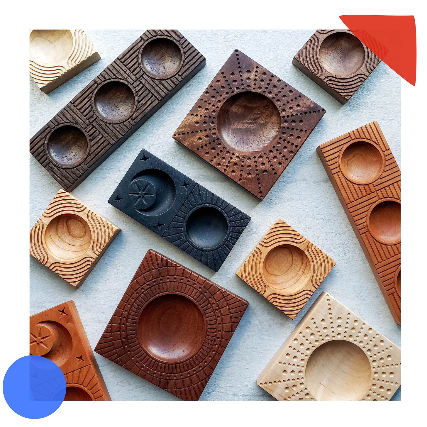 an overhead photo of ravioli molds in a variety of wooden hues, with different carved patterns