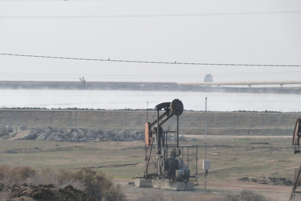 Oil companies heat water or steam to extract Kern County's heavy oil. Wastewater from Chevron's drilling operations is still hot when it arrives at this holding pond near Bakersfield. Credit: Liza Gross Oil companies heat water or steam to extract Kern County's heavy oil. Wastewater from Chevron's drilling operations is still hot when it arrives at this holding pond near Bakersfield. Credit: Liza Gross