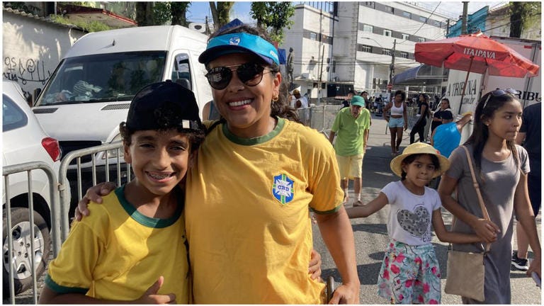 Sandra Garcia and her son Enzo are among Pele's fans