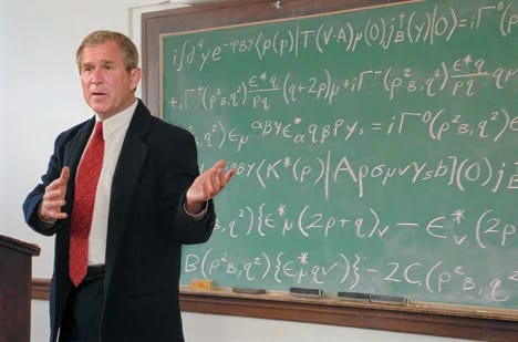 George W. Bush stands in front of a chalkboard filled with mathematical equations.