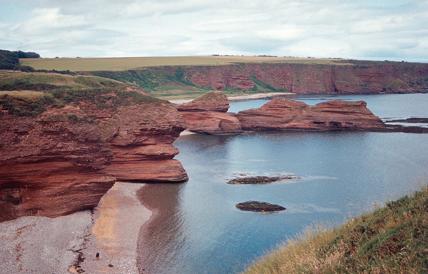 "The Three Sisters", other cliffs and a pebble beach near Arbroath, Scotland