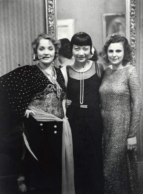black and white photo of Marlene Dietrich, Anna May Wong & Leni Riefenstahl at a Berlin ball