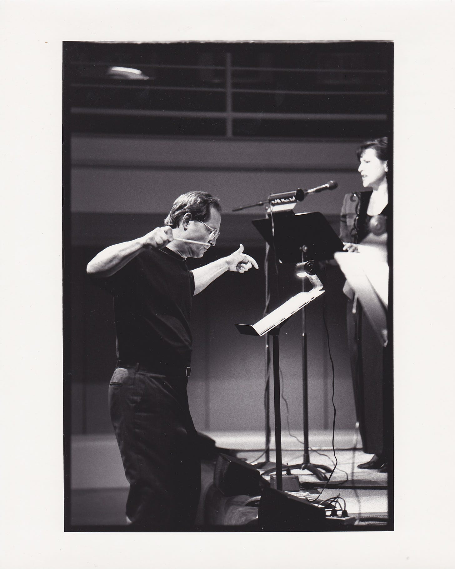 Jan Krzywicki conducting with soprano Jody Kidwell in background