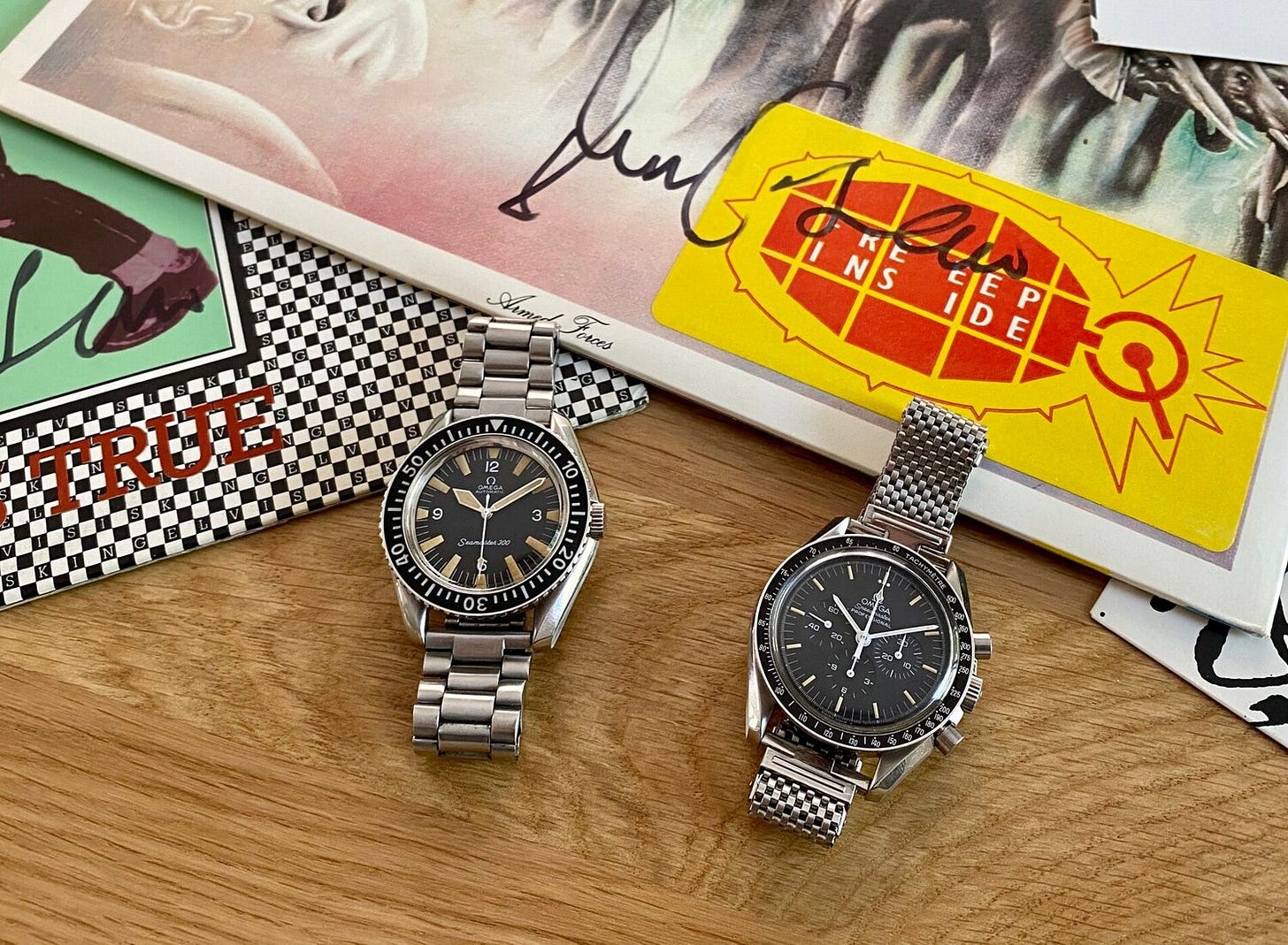 Jesse’s Omega Seamaster 300, Speedmaster Professional, with signed Elvis Costello records |  Photo courtesy of Jesse Johnson