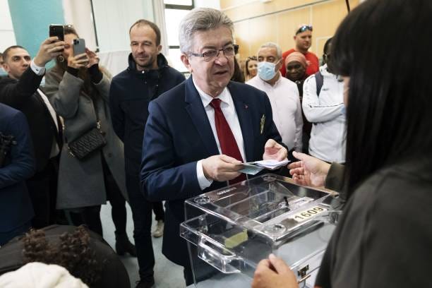 Jean-Luc Melenchon, French presidential candidate, casts his vote at a polling station during the first round of the French presidential election in...