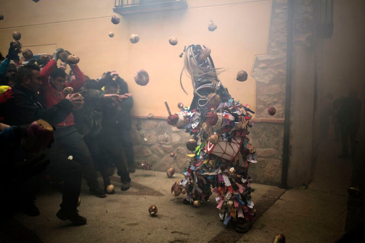 People throw turnips at the Jarramplas on January 19, 2019, in Piornal.