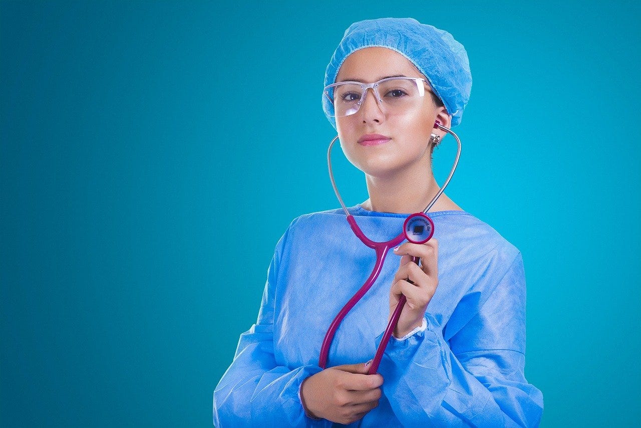 Nurse in blue scrubs with stethoscope