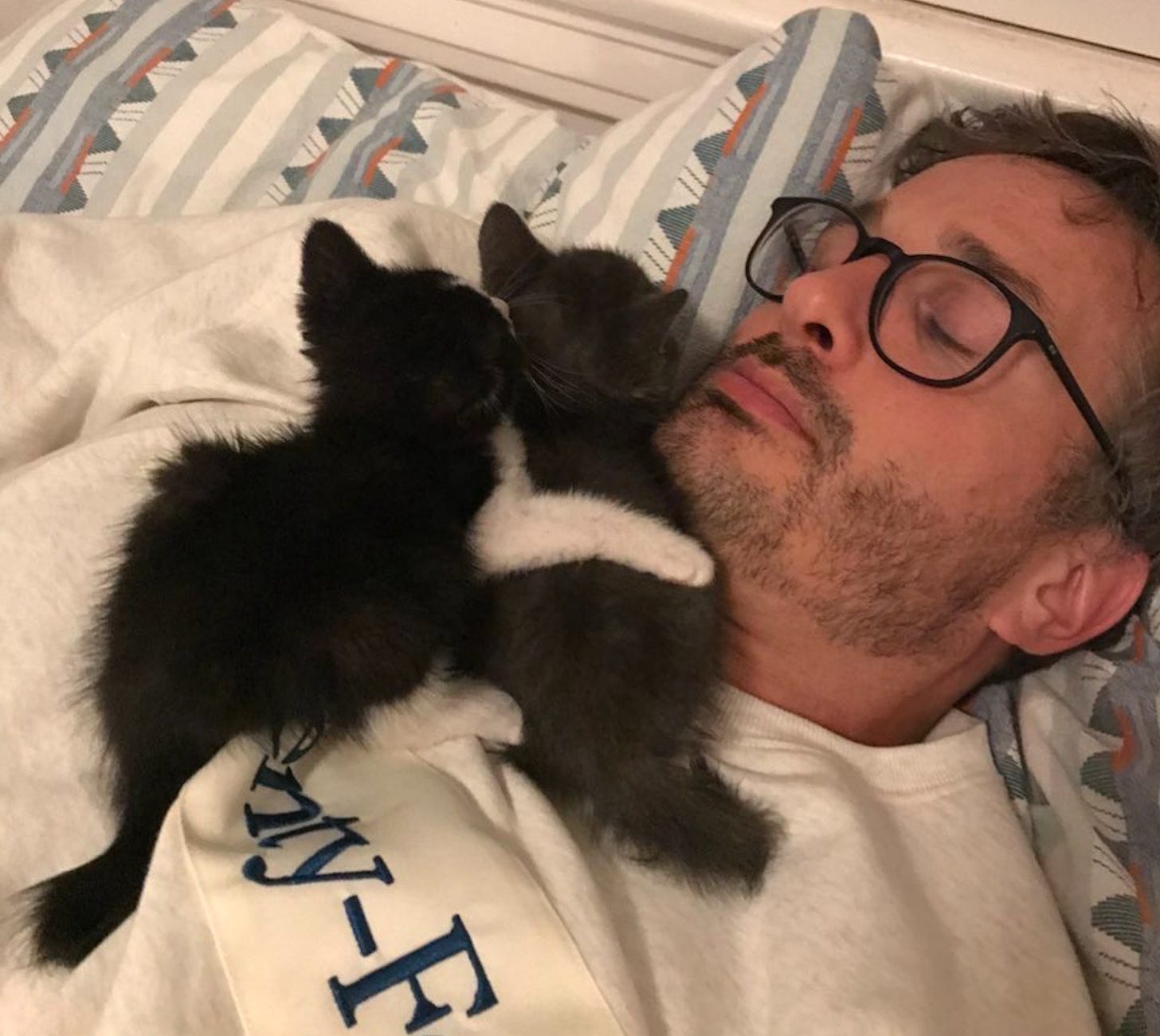me with two kittens sleeping on me!