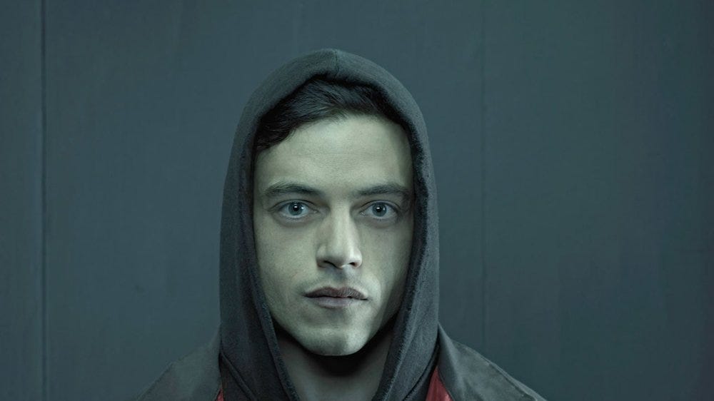 Elliot Alderson, the “Cypherpunk” in the fictional show “Mr. Robot.” He joins a group that aims to destroy all debt records by encrypting the financial data of the largest conglomerate in the world, E Corp.