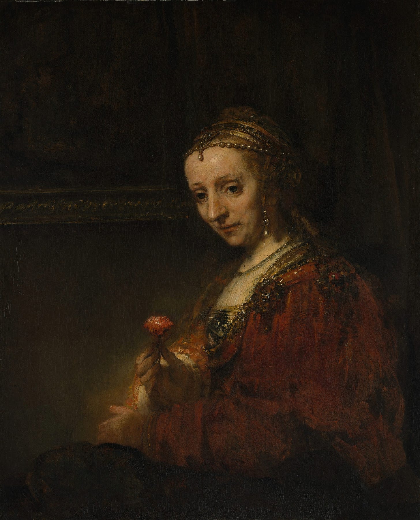 Woman with a Pink (early 1660s) by Rembrandt van Rijn