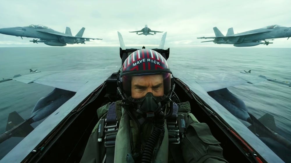Tom Cruise is Maverick, piloting an F-18 with three more behind him