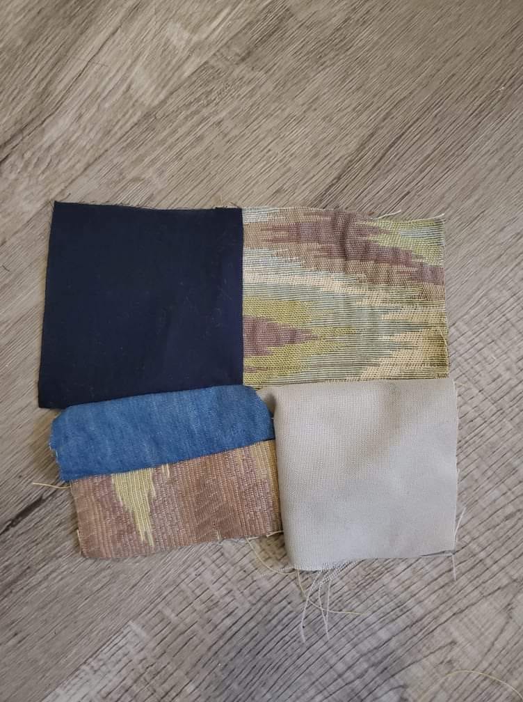 An image of fabric pieces sewn together and laid out on a wooden floor.
