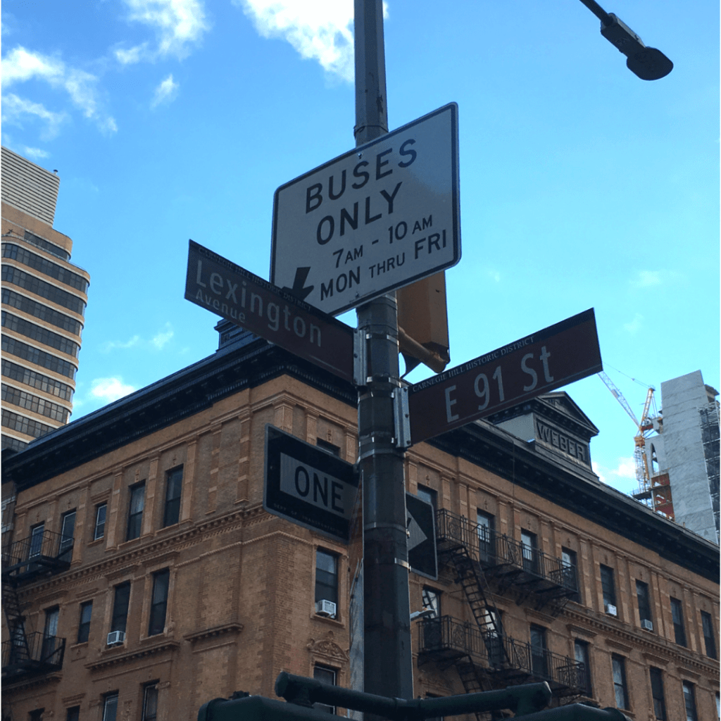 Street signs at the intersection of Lexington Avenue and 91st Street in Manhattan.