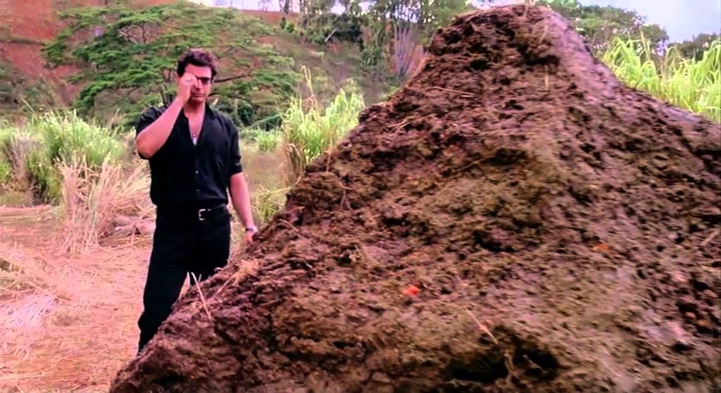 Jeff Goldblum looks on at a massive pile of dinosaur poop, from the film Jurassic Park.