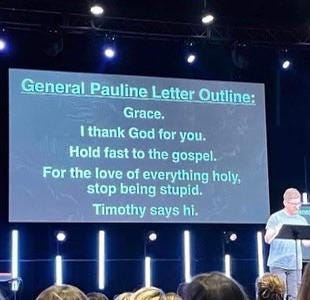 A powerpoint presentation in front of an audience shows a screen summing up the General Form of a Pauline Letter: Grace / I thank God for you / Hold fast to the Gospel / For the love of everything holy, stop being stupid. / Timothy says hi.