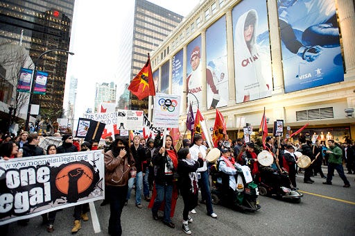 Demonstrators Rally Against The Olympics In 2010