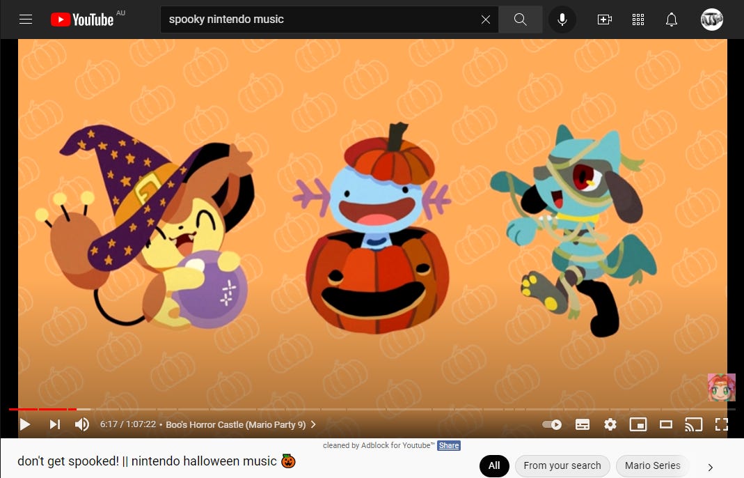 A screen shot of a YouTube video with the words YouTube AU spooky nintendo musc, don't get spooked! nintendo halloween music' around the frame; the video is of three cartoon characters in Halloween outfits.