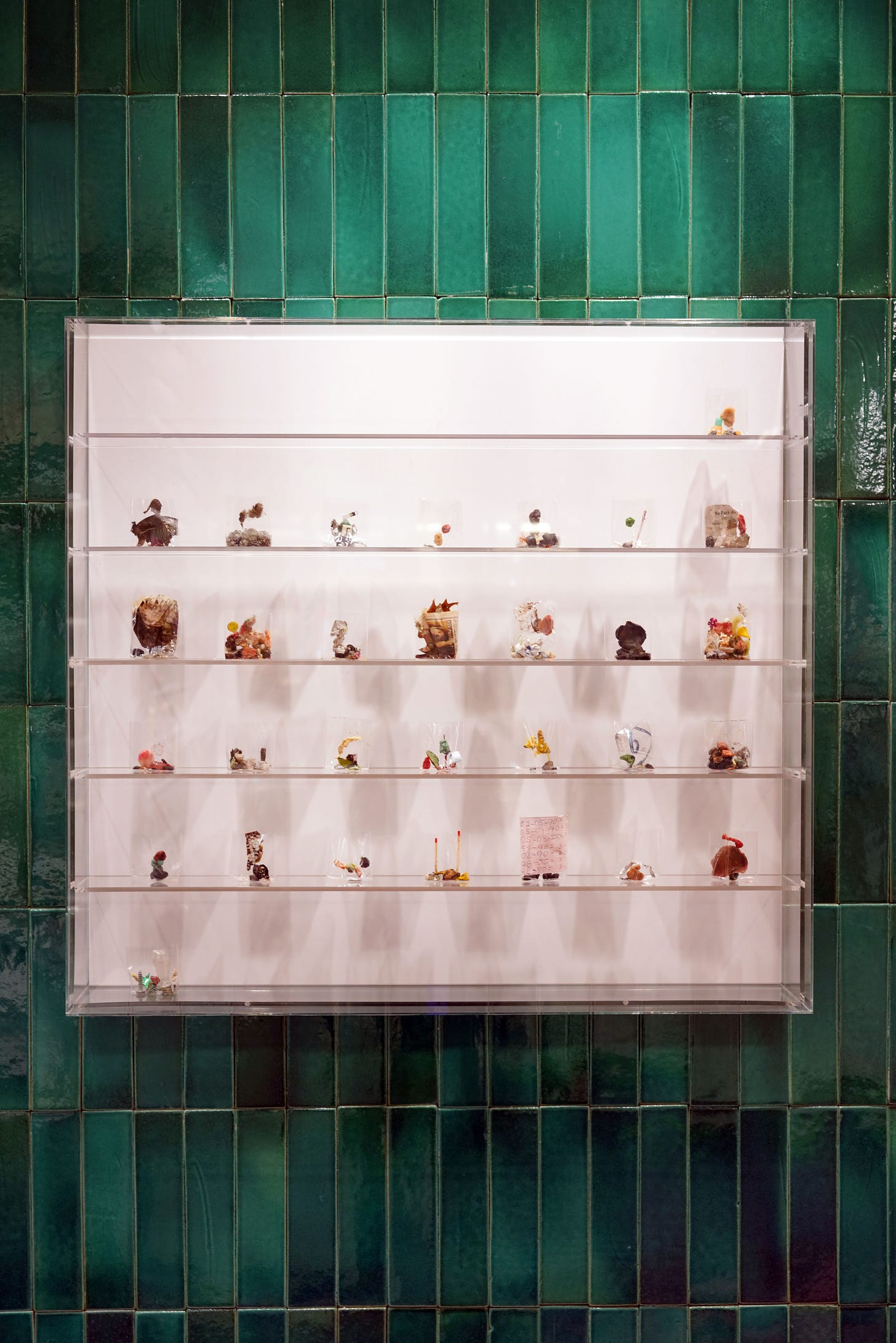 Debris sculptures by Yuji Agematsu, framed by hand-moulded tiles baked in Valencia. Loewe store, South Coast Plaza, 2020. Courtesy
