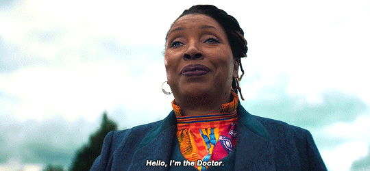 This GIF (repeated moving image) shows the Fugitive Doctor--or Ruth Doctor (played by Jo Martin)--introducing herself by smiling and repeating the words, "Hello, I'm the Doctor."