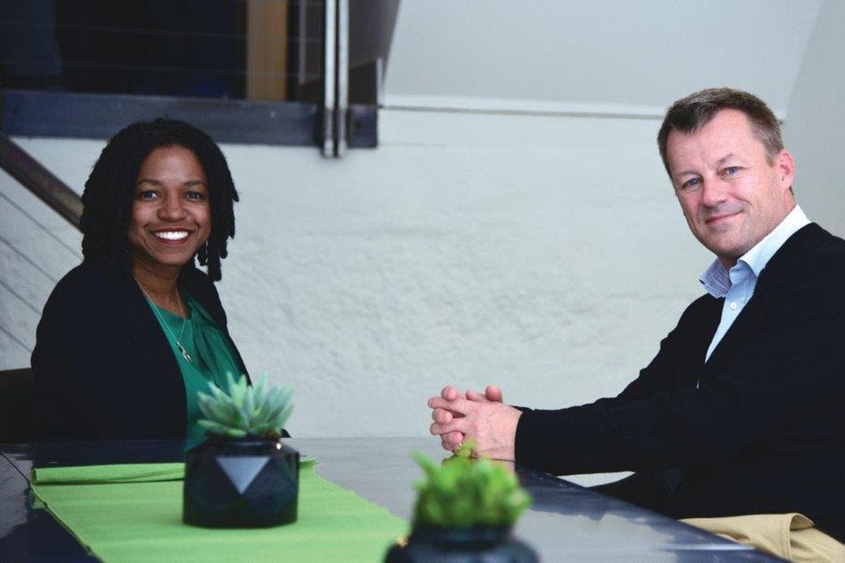 The heads of TaskRabbit and Ikea Group, Stacy Brown-Philpot and Jesper Brodin, sit at a table.